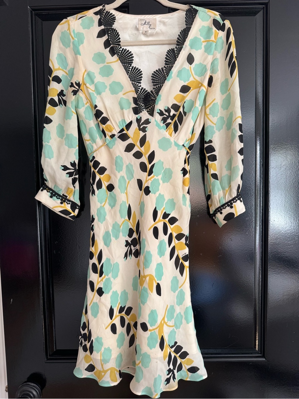 Milly Elegant Cream, Aqua and Black Dress with beautiful scallop edging.